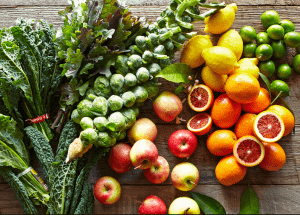 a group of fruits and vegetables on a wood surface Healthy Weight Loss Diets Nottingham
