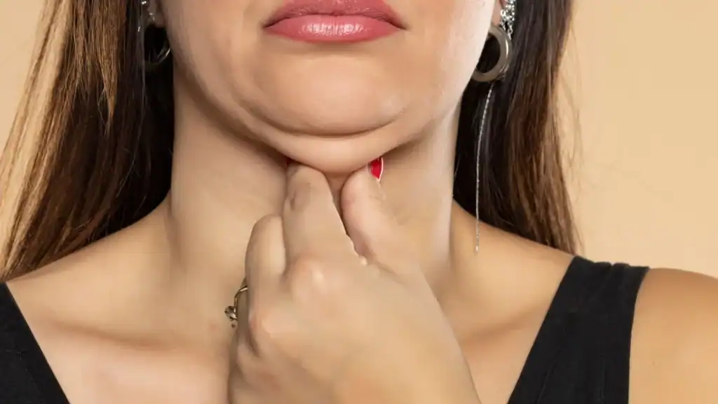 An image of a woman with double chin, sad, worried : Non Surgical Double Chin Removal Treatment in Nottingham, UK